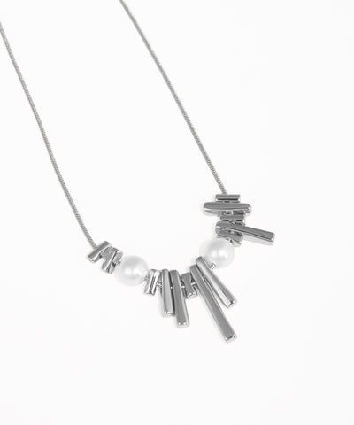 Necklace with metallic bars and pearls on a white background