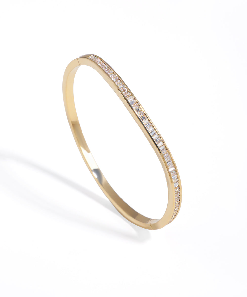 Gold-tone bracelet with central baguette and pavé crystal inlay design