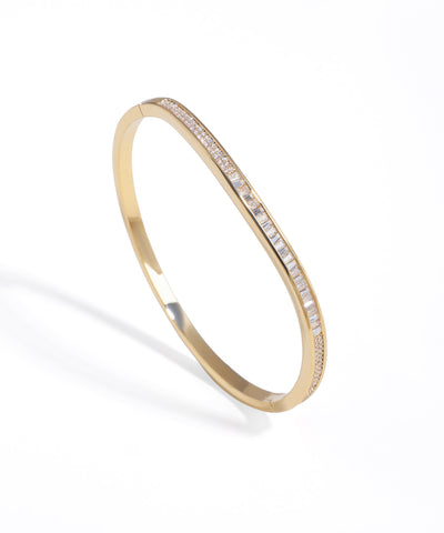 Gold-tone bracelet with central baguette and pavé crystal inlay design