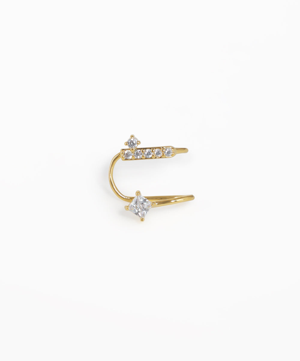 Gold-tone earring with a curved bar and square and round stones