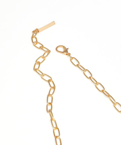 Gold chain necklace on a white background