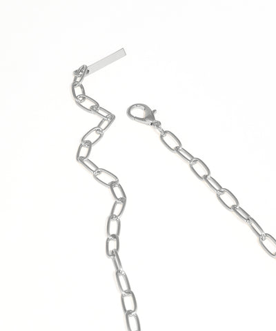 Silver chain necklace on a white background