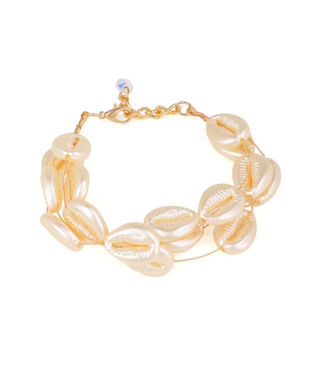 Gold-tone bracelet with double row of off-white faux pearl shell beads and a small iridescent glass crystal charm.