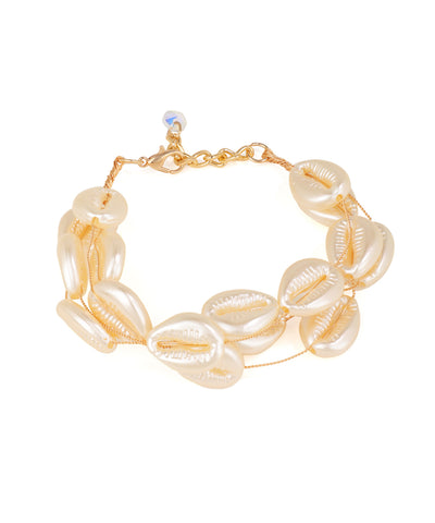 Gold-tone bracelet with double row of off-white faux pearl shell beads and a small iridescent glass crystal charm.