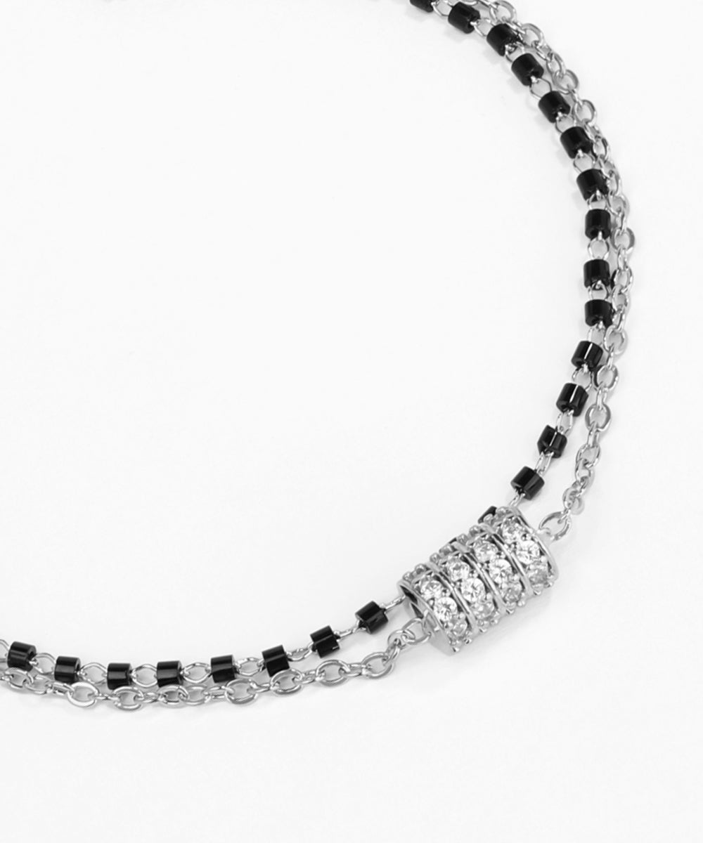 Necklace with black and clear beads on a white background