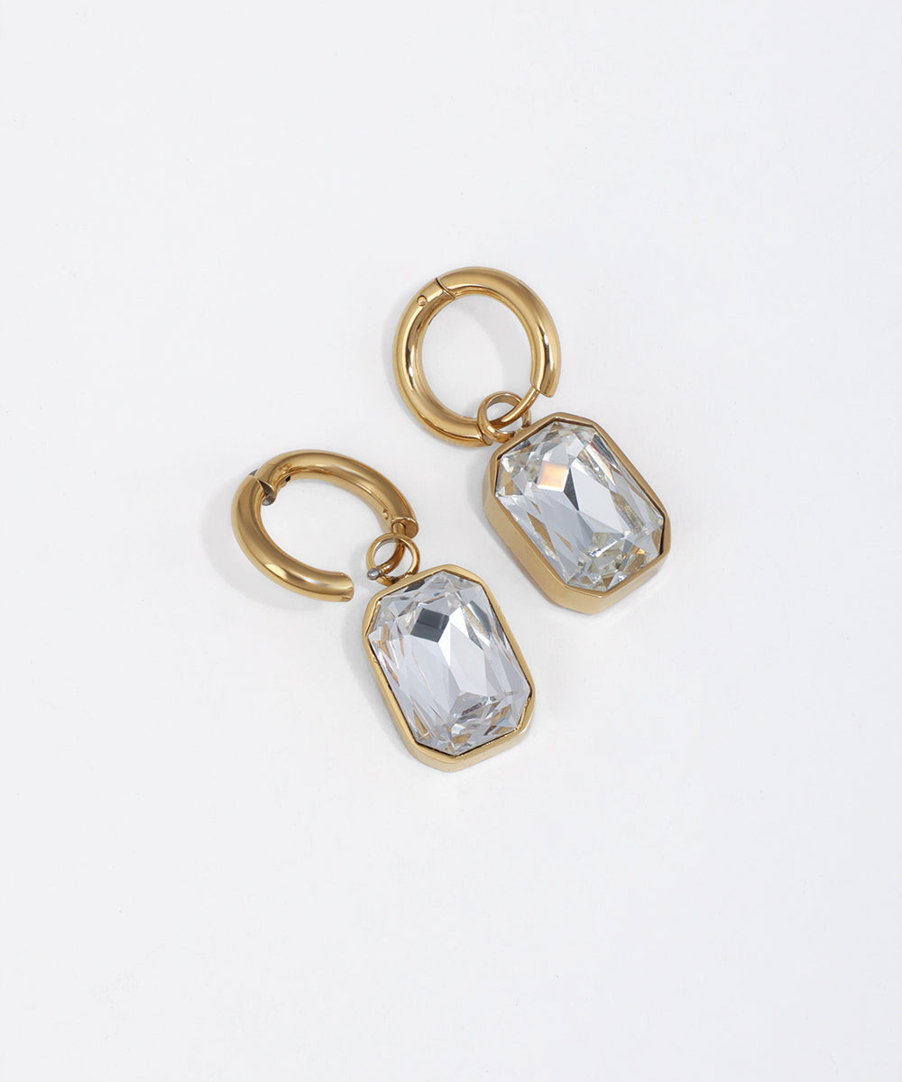 Gold-tone huggie earrings with emerald cut clear glass crystal drop