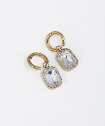 Gold-tone huggie earrings with emerald cut clear glass crystal drop
