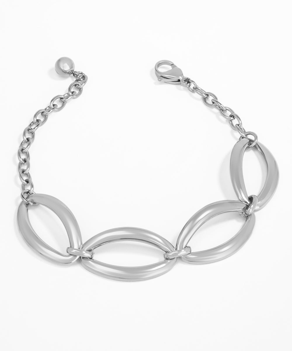 Silver bracelet with interlocking loops on a white background