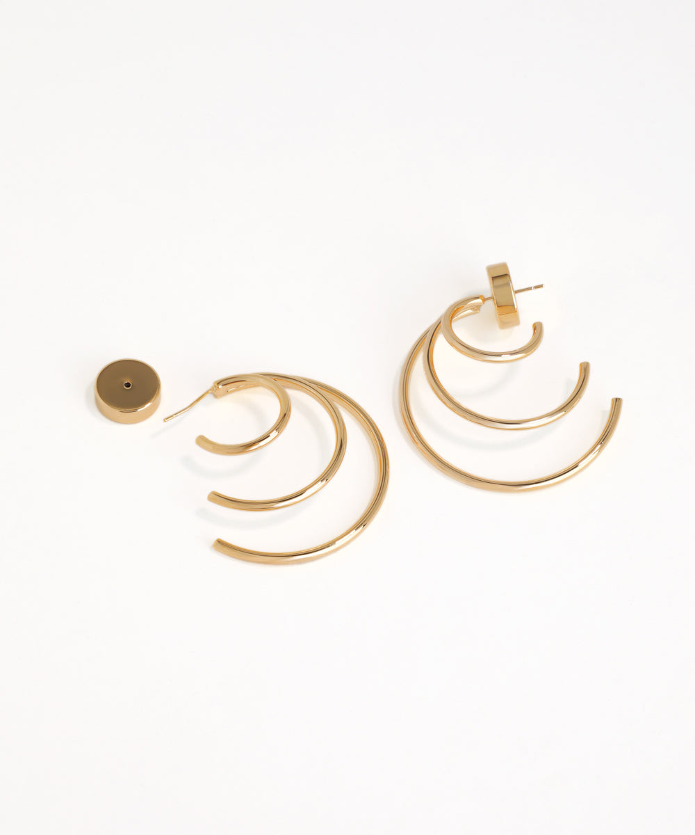 Gold hoop earrings on a white background