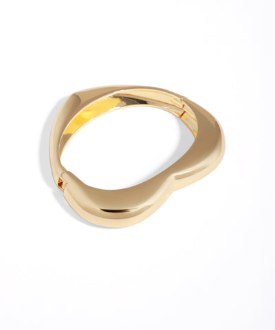 Gold ring with a unique design on a white background