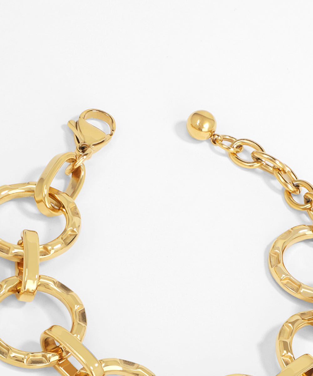 Gold chain bracelet on a white background