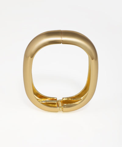 Gold ring with a unique design on a white background