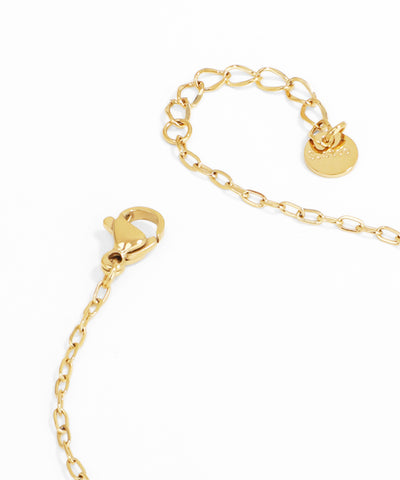 Gold chain bracelet with a heart lock clasp on a white background