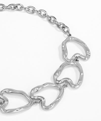 Silver chain bracelet with heart-shaped links on a white background