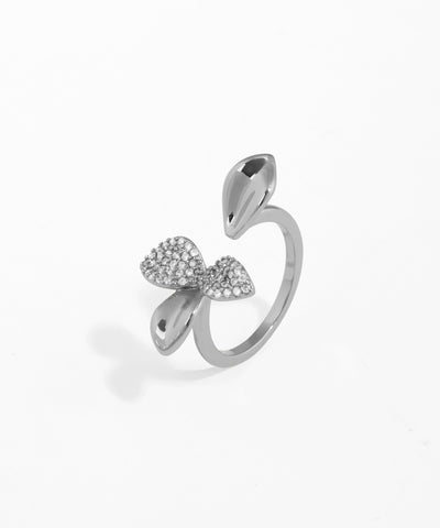 Silver bow-shaped ring on a white background