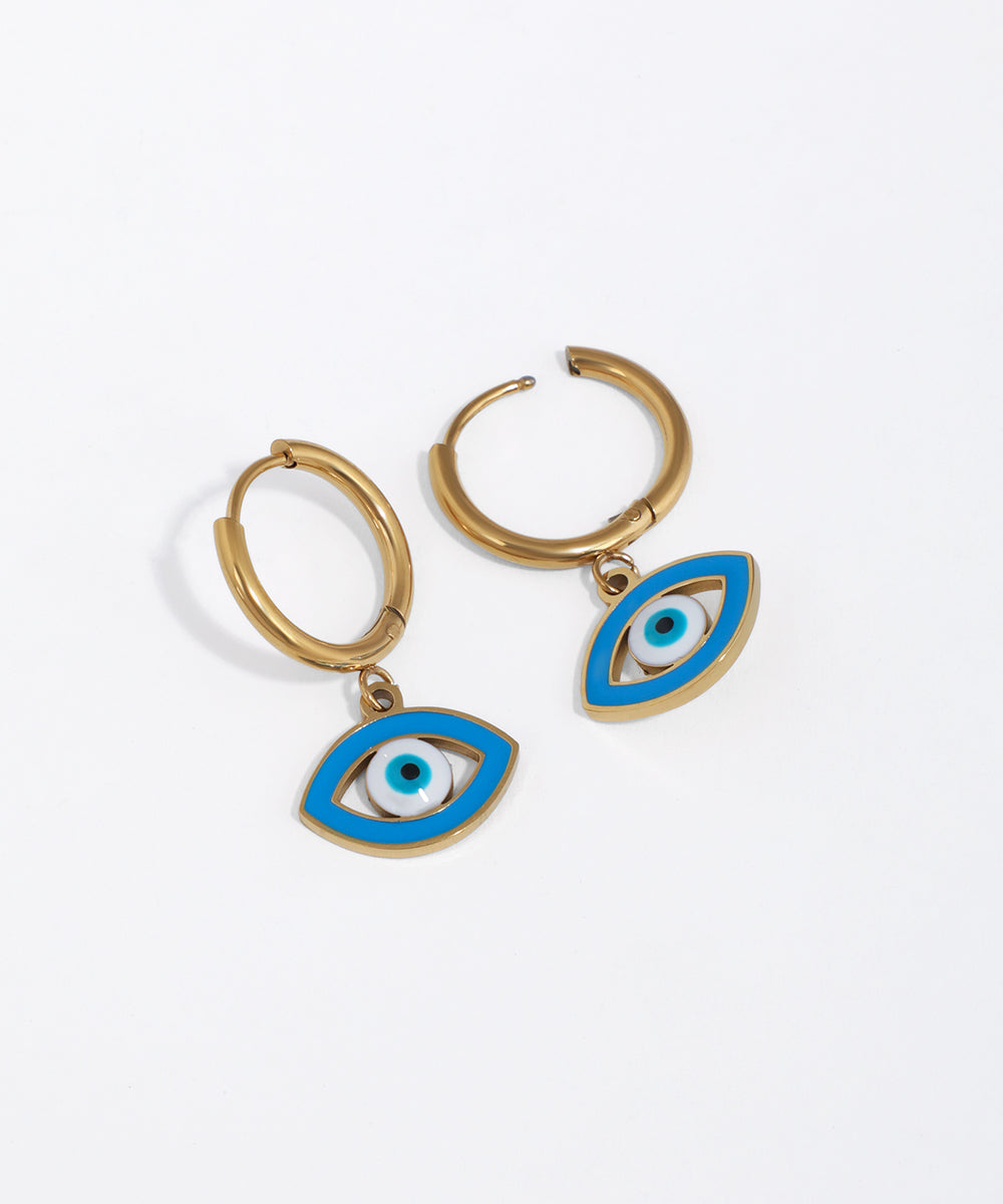 Gold-tone hoop earrings with an oval evil eye charm featuring blue and white enamel.