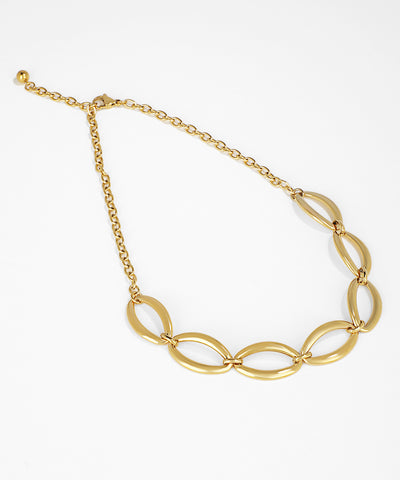 Gold chain necklace on a white background