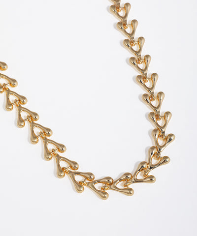 Gold chain necklace on a white background