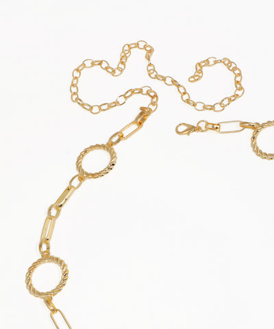 Gold chain necklace on a white background