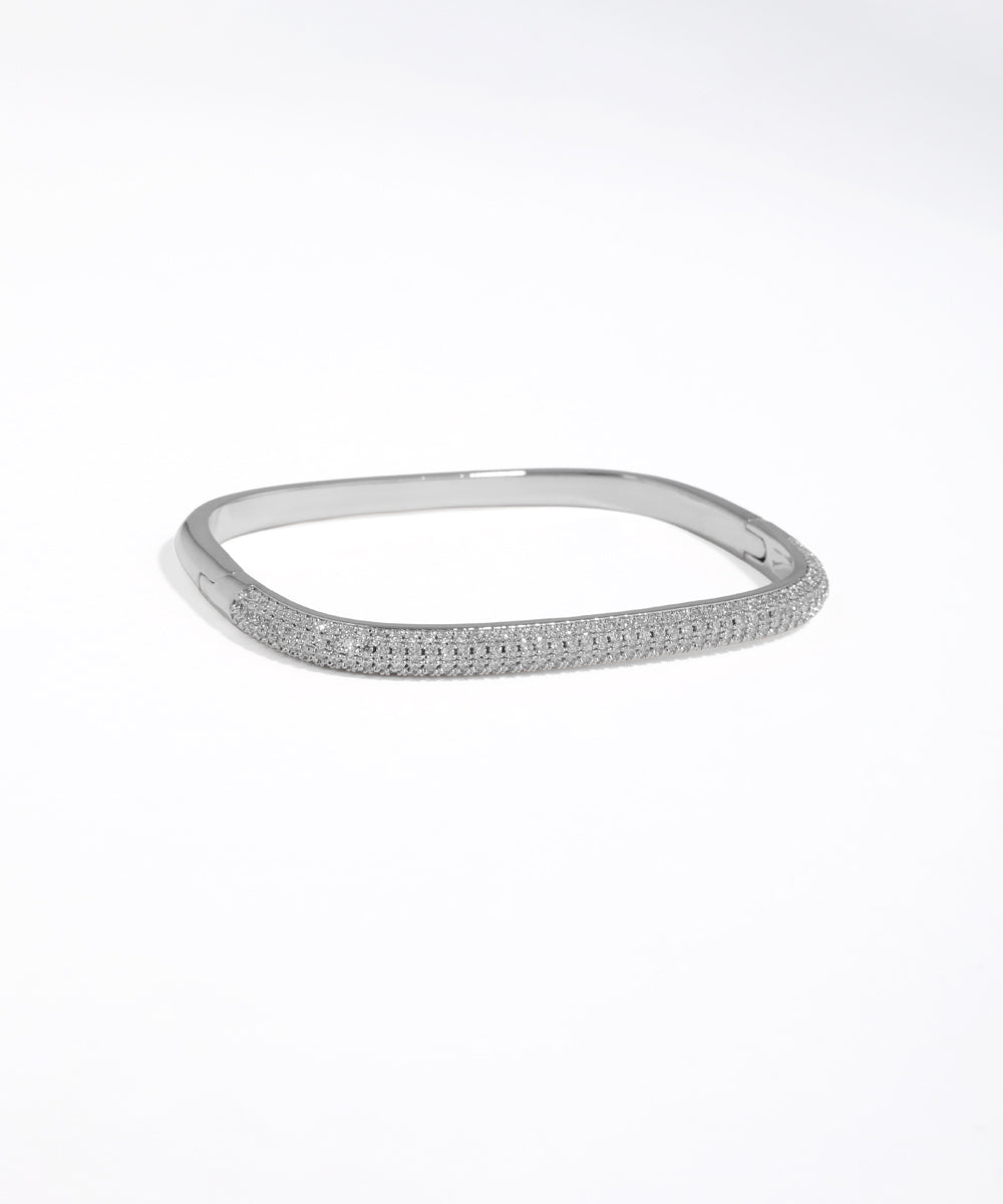 Silver bracelet with small stones on a white background