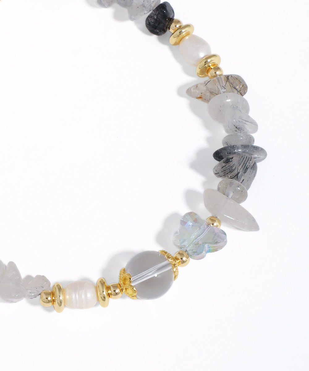 Necklace with multicolored beads on a white background