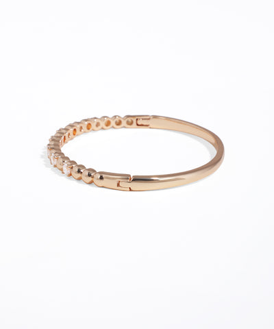 Rose gold bracelet on a white background