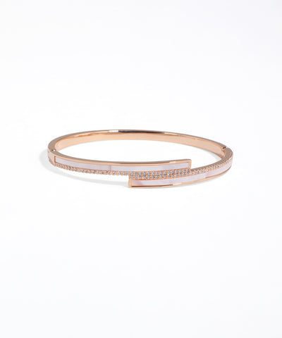 Rose gold bracelet with small rectangular gemstones on a white background