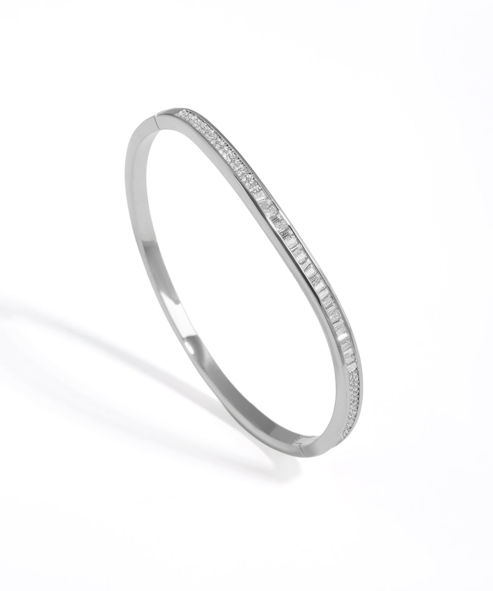 Silver bracelet with small stones on a white background