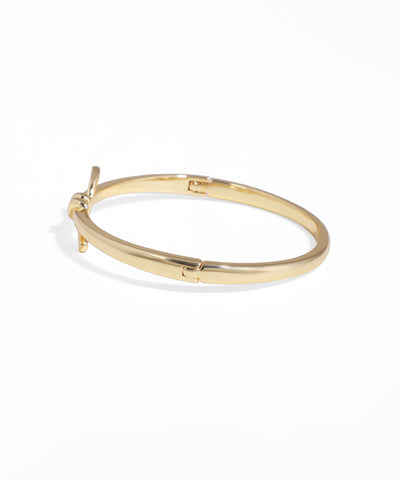 Gold hoop earring on a white background