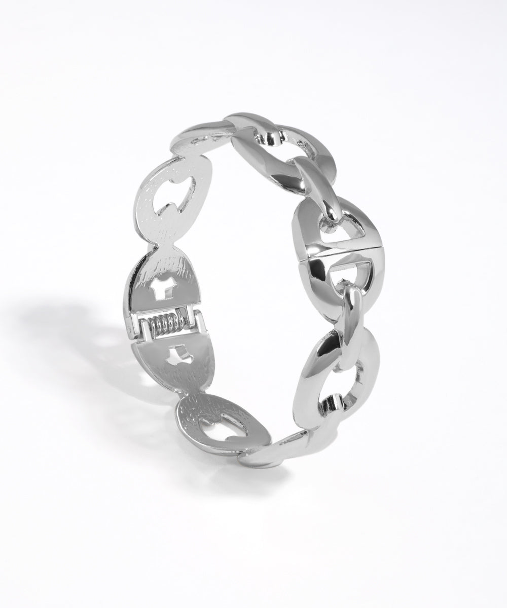 Silver chain-style ring on a white background