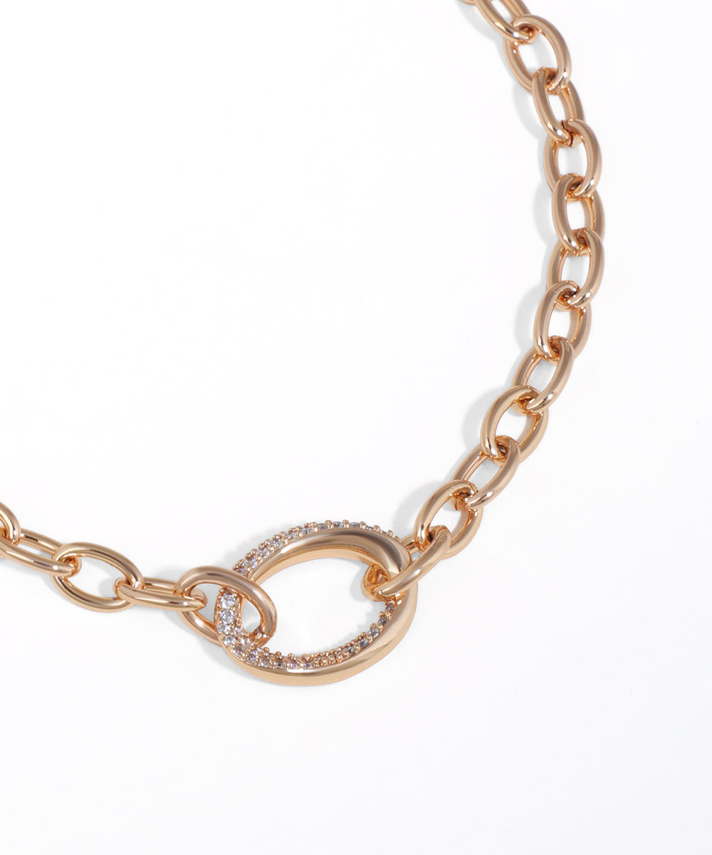 Rose gold chain bracelet with a clasp on a white background