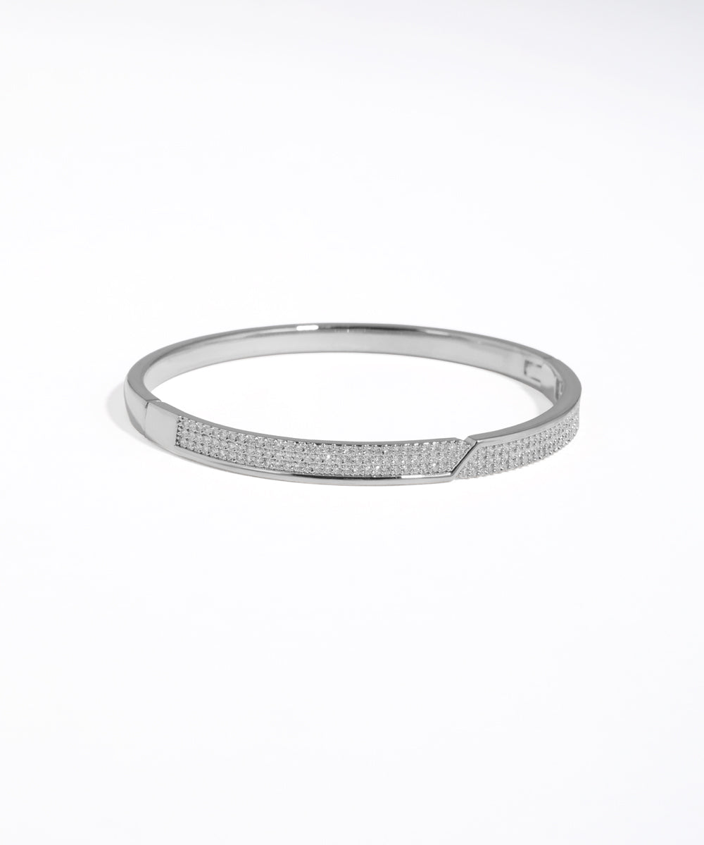 Silver bracelet with small stones on a white background