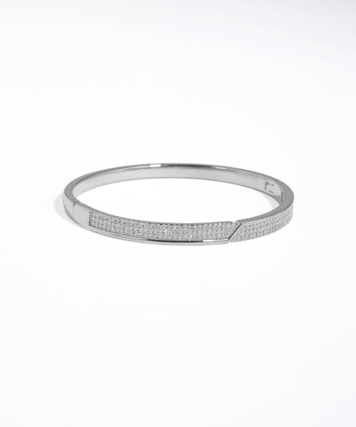 Silver bracelet with small stones on a white background