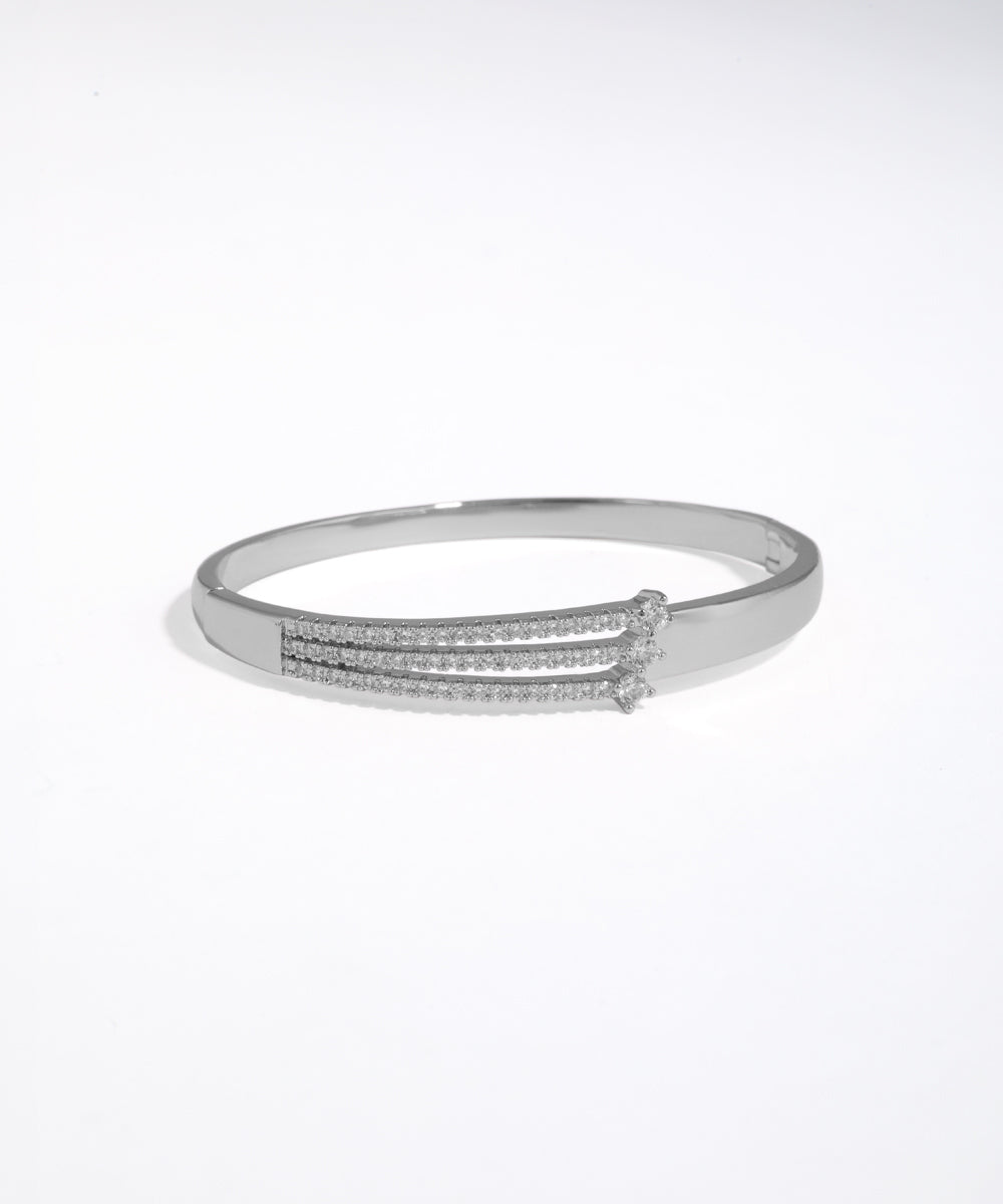 Silver bracelet with small stones on a white background