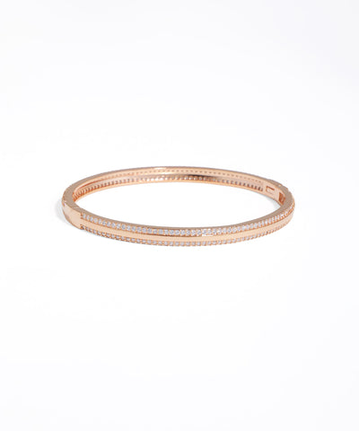 Rose gold bracelet with clear stones on a white background