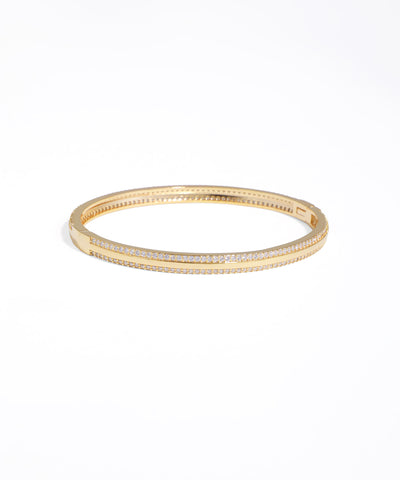 Gold bracelet with embedded stones on a white background