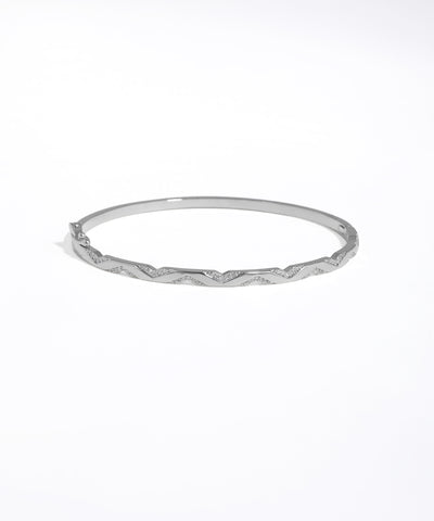 Silver bangle on a white background
