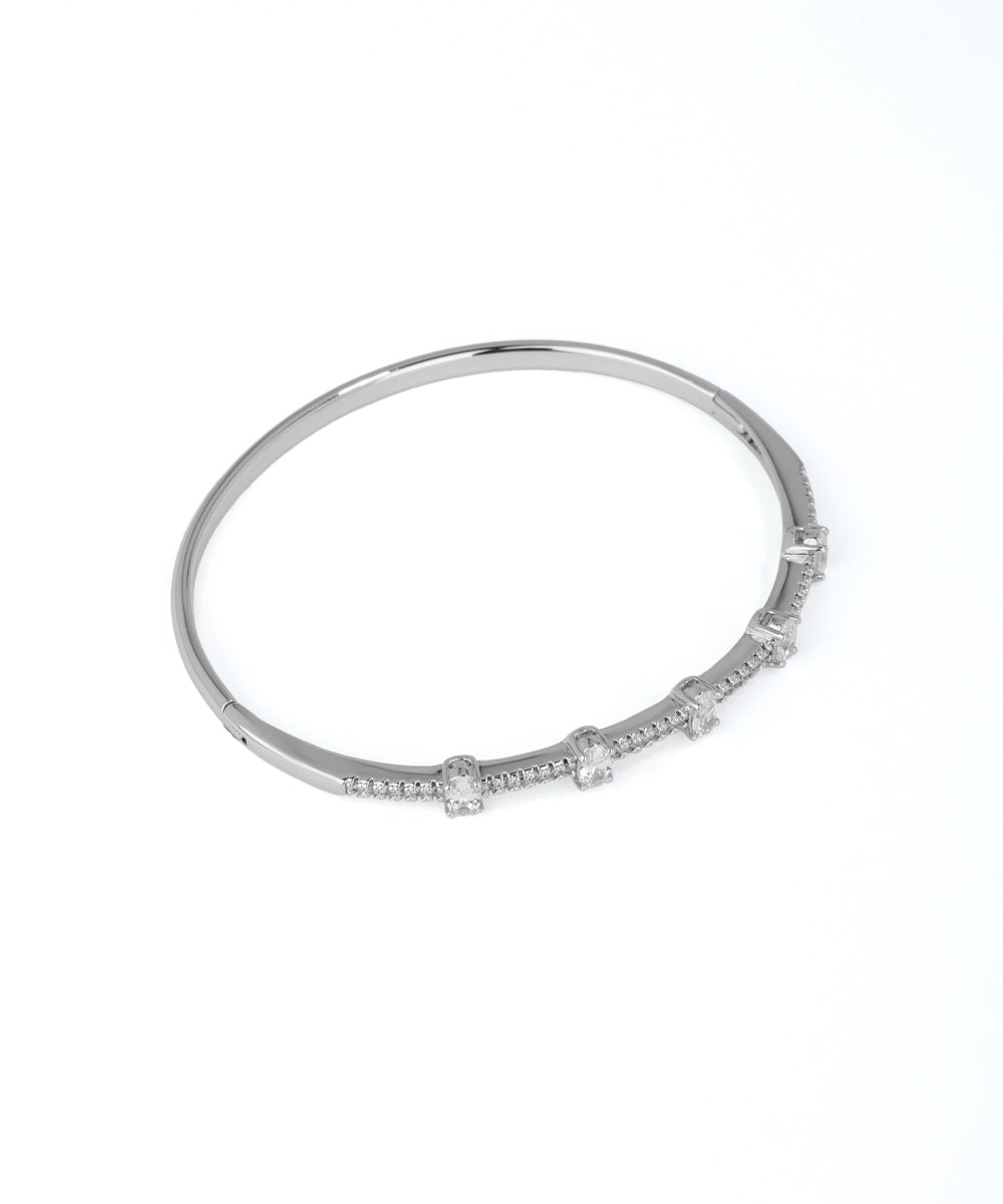 Silver bracelet with small diamonds on a white background