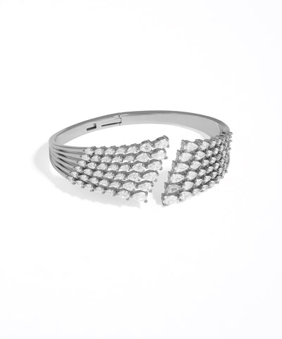 Silver bracelet with diamond-like stones on a white background