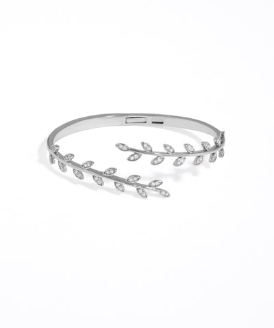 Silver bracelet with leaf design on a white background