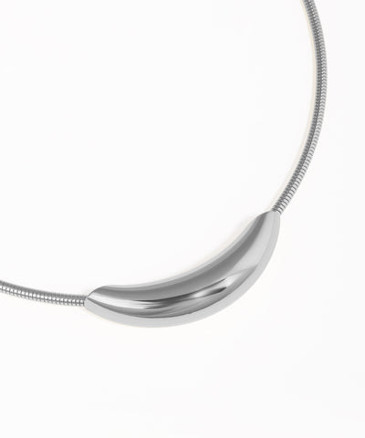 Silver necklace with a curved pendant on a white background