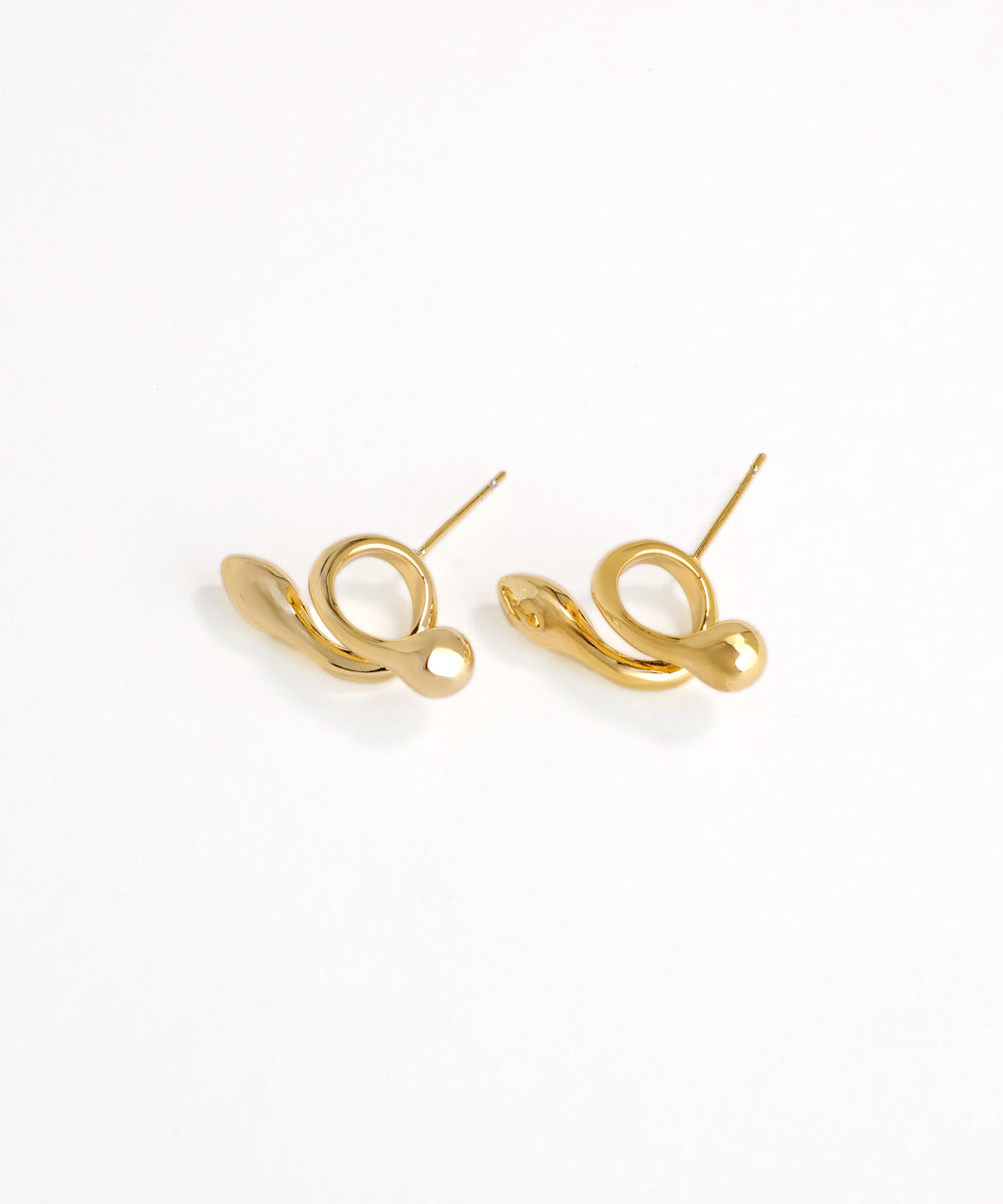 Gold earrings on a white background
