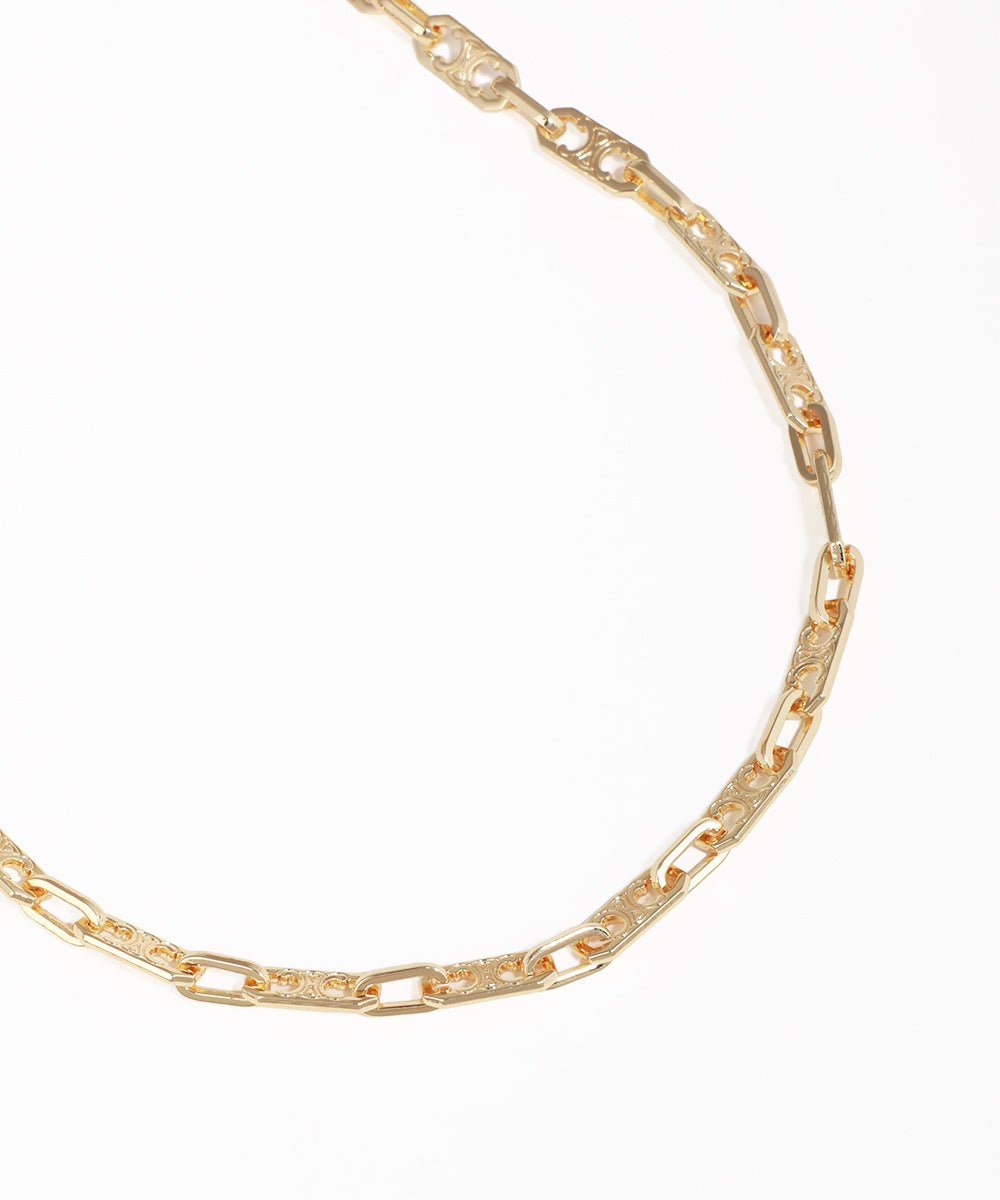 Gold chain necklace on a white background