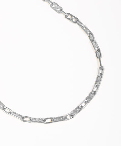 Silver chain necklace on a white background