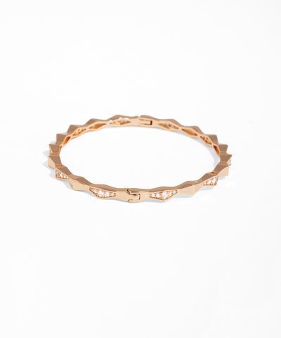 Rose gold ring with a textured band on a white background