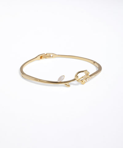 Gold bracelet on a white background