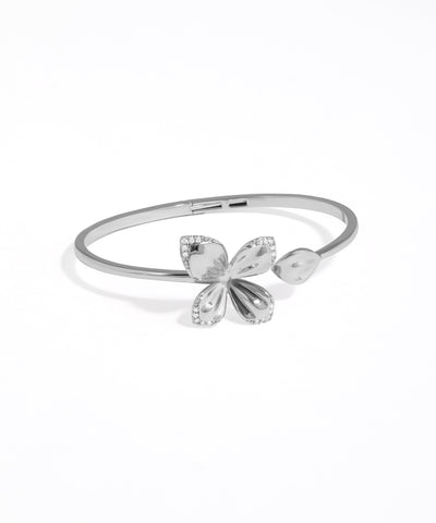 Silver bracelet with butterfly design on a white background