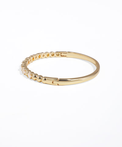Gold bracelet on a white background