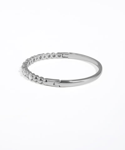 Silver ring with small stones on a white background