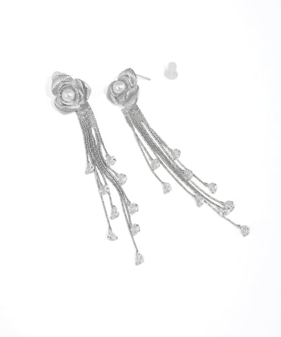 Silver earrings with floral design and tassels on a white background